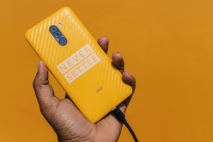 Yellow OnePlus smartphone with Never Settle logo - OnePlus shutdown in Kannada