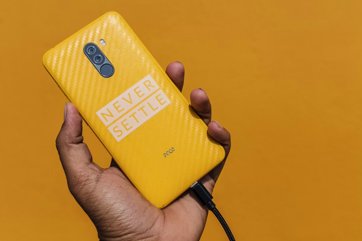 Yellow OnePlus smartphone with Never Settle logo - OnePlus shutdown in Kannada